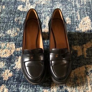 Black patent leather Clark’s heeled loafer